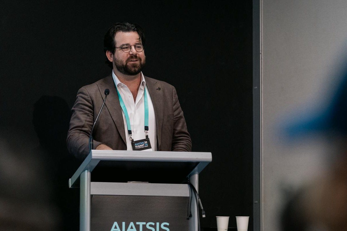 Jordan Ala'i speaking at a lectern at the AIATSIS Summit 2026